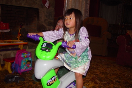 Kasen on her Smart Cycle from Santa